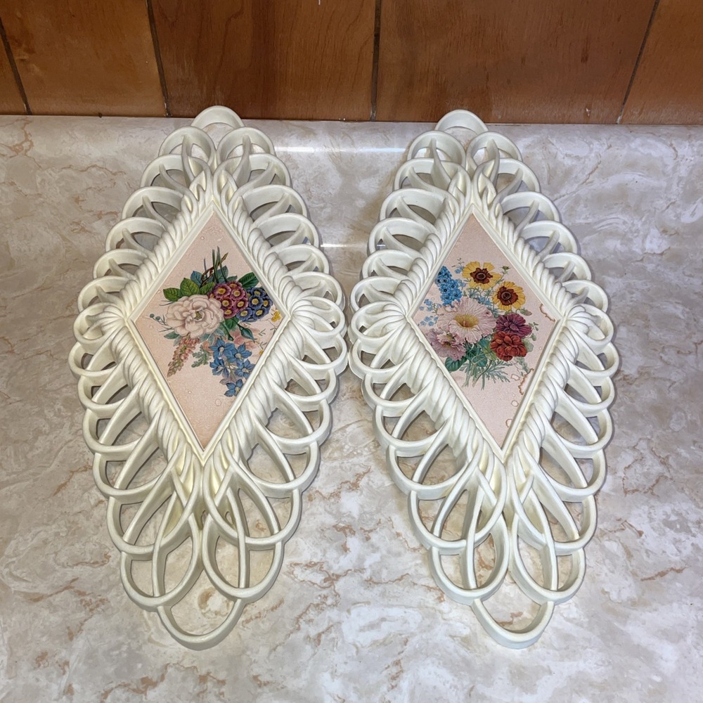 Pair of 1975 Burwood diamond‎ shaped wall plaques, floral design